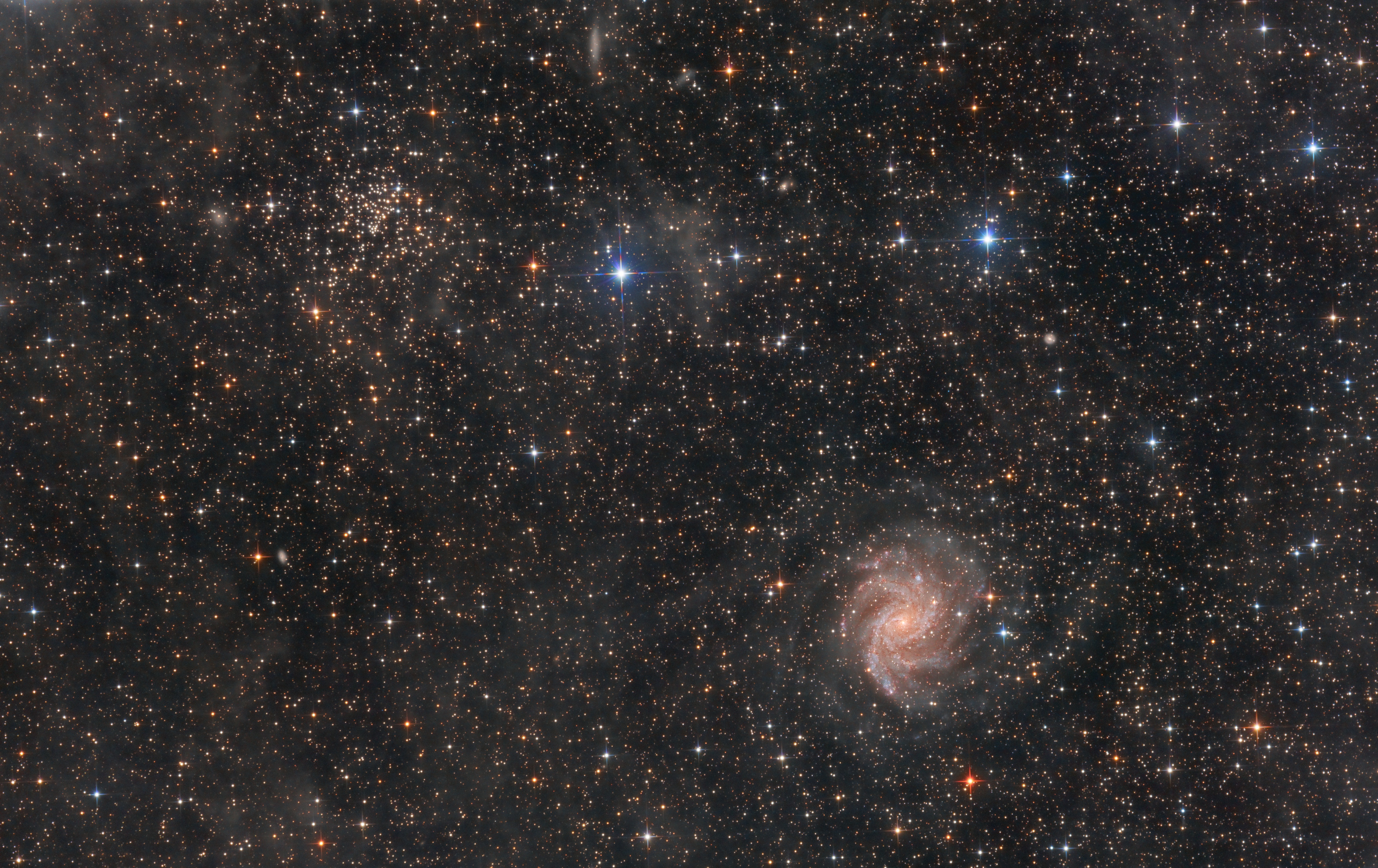 The Starburst Spiral Galaxy NGC 6946 and the Open Cluster NGC 6939
